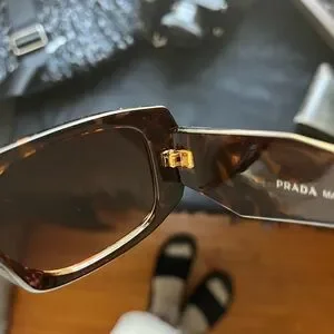 Elegant Prada sunglasses with a chic tortoise pattern.
Ideal for stylish outings Prada | Accessories | Elegant Prada Sunglasses With A Chic  main image 2